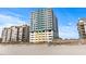 Beachfront condo complex showcasing a modern design and direct access to the sandy shores at 2301 S Ocean Blvd. # 1401, North Myrtle Beach, SC 29582