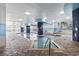 Inviting indoor pool and hot tub area, designed with blue and white accents and tiled flooring at 2301 S Ocean Blvd. # 1401, North Myrtle Beach, SC 29582