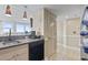 Cozy kitchen with granite counters and view to outside balcony at 2301 S Ocean Blvd. # 1401, North Myrtle Beach, SC 29582