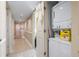 Convenient in-unit laundry area with stacked washer and dryer, maximizing space at 2301 S Ocean Blvd. # 1401, North Myrtle Beach, SC 29582
