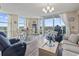 Open concept living area with balcony access, comfortable seating at 2301 S Ocean Blvd. # 1401, North Myrtle Beach, SC 29582