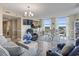 Bright living room featuring wood floors, modern furnishings, and expansive windows with scenic views at 2301 S Ocean Blvd. # 1401, North Myrtle Beach, SC 29582