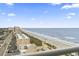 Breathtaking ocean view from the balcony, showcasing the beach, coastline, and the buildings nearby at 2301 S Ocean Blvd. # 1401, North Myrtle Beach, SC 29582