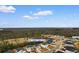 Aerial view showcases 242 Timber Oaks Drive home within a cozy neighborhood near wooded areas at 242 Timber Oaks Dr., Myrtle Beach, SC 29588