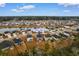 Aerial view of community featuring home at 242 Timber Oaks Drive situated by a pond and lush greenery at 242 Timber Oaks Dr., Myrtle Beach, SC 29588