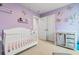 Charming Bedroom with white crib, changing table, and delicate butterfly decor at 242 Timber Oaks Dr., Myrtle Beach, SC 29588