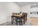 Traditional dining room featuring a wooden table and six chairs set on a gray rug at 242 Timber Oaks Dr., Myrtle Beach, SC 29588