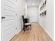 Inviting entryway with light wood floors, complemented by modern decor and a chair for added charm at 242 Timber Oaks Dr., Myrtle Beach, SC 29588