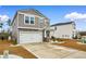 Two-story home exterior with a two car garage and manicured lawn at 242 Timber Oaks Dr., Myrtle Beach, SC 29588