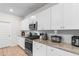 Contemporary kitchen with granite counters, stainless appliances, and white cabinets at 242 Timber Oaks Dr., Myrtle Beach, SC 29588