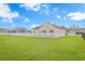 Expansive backyard featuring lush green lawn and a charming white picket fence, ideal for relaxing or entertaining at 256 Maple Oak Dr., Conway, SC 29526