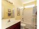 Yellow bathroom featuring a bright vanity and a toilet with a shower and light fixtures at 256 Maple Oak Dr., Conway, SC 29526