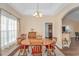 Comfortable dining area featuring a wood table, chairs, and a view into the kitchen at 256 Maple Oak Dr., Conway, SC 29526