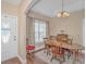 Elegant dining room with wood table, chairs, and a decorative light fixture, perfect for Gathering gatherings at 256 Maple Oak Dr., Conway, SC 29526