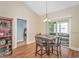 Dining room showcases a wooden table, seating for four, pendant lighting, and flows into the bedroom at 256 Maple Oak Dr., Conway, SC 29526