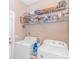 A laundry room featuring a washer, dryer, and wire shelving with ample space for storage at 256 Maple Oak Dr., Conway, SC 29526