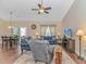 Inviting living area featuring a ceiling fan, cozy seating, and a view into the dining area at 256 Maple Oak Dr., Conway, SC 29526