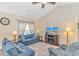 Bright and airy living room with vaulted ceiling, comfortable seating, and a flat-screen TV at 256 Maple Oak Dr., Conway, SC 29526