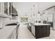 A modern kitchen with stainless steel appliances, a large center island, and ample counter space at 2849 Old Bryan Dr., Myrtle Beach, SC 29577