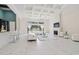 Spacious living room with coffered ceiling, fireplace, and a view of the pool at 2849 Old Bryan Dr., Myrtle Beach, SC 29577