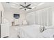 Bright main bedroom with a tray ceiling, fireplace, white armchair and decor, and marble floors at 2849 Old Bryan Dr., Myrtle Beach, SC 29577