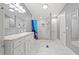 Modern bathroom featuring a glass-enclosed shower and a marble countertop at 287 Kanawha Trail, Longs, SC 29568