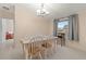 Charming dining room with natural light, a dining table for four, and neutral decor at 287 Kanawha Trail, Longs, SC 29568