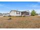 Charming single story home with a screened in porch and tidy front yard at 287 Kanawha Trail, Longs, SC 29568