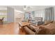 Bright and airy living room with hardwood floors, comfortable seating, view of dining and kitchen at 287 Kanawha Trail, Longs, SC 29568