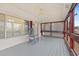 Relaxing screened-in porch with ceiling fan and rocking chair at 287 Kanawha Trail, Longs, SC 29568