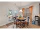 Cozy breakfast nook features a round table, four chairs, and doors leading to the outdoor patio at 3000 Chesterwood Ct., Myrtle Beach, SC 29579