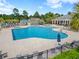 Spacious community pool with lounge chairs, umbrellas, and well-maintained landscaping, perfect for relaxation and recreation at 3000 Chesterwood Ct., Myrtle Beach, SC 29579