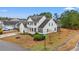 Aerial view of a two-story home with well-maintained landscaping, a two car garage, and beautiful surroundings at 3000 Chesterwood Ct., Myrtle Beach, SC 29579