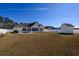 Expansive backyard with a shed, patio area, and white fence, perfect for outdoor activities at 302 Camrose Way, Myrtle Beach, SC 29588