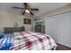 Inviting bedroom with a large bed, ceiling fan, and ample storage at 302 Camrose Way, Myrtle Beach, SC 29588