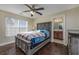 Comfortable bedroom with a gray bed frame, ceiling fan, and attached bathroom at 302 Camrose Way, Myrtle Beach, SC 29588