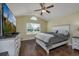 Bright bedroom with a large window, television, and a comfortable bed at 302 Camrose Way, Myrtle Beach, SC 29588