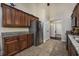 Spacious kitchen with stainless steel refrigerator and granite countertops at 302 Camrose Way, Myrtle Beach, SC 29588