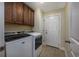 Functional laundry room with modern washer and dryer at 302 Camrose Way, Myrtle Beach, SC 29588