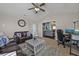 Inviting living room with leather sofa, large clock, and view to another living space at 302 Camrose Way, Myrtle Beach, SC 29588