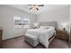 Bright bedroom with a comfortable queen-size bed, neutral decor, and ample natural light from the large window at 349 Lakota Loop, Longs, SC 29568