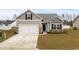 Charming single-story home features a two-car garage and well-maintained landscaping at 349 Lakota Loop, Longs, SC 29568