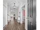 Entryway hallway featuring hardwood floors and a decorative light fixture at 349 Lakota Loop, Longs, SC 29568