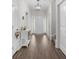 Entryway hallway featuring hardwood floors with white trim and neutral paint at 349 Lakota Loop, Longs, SC 29568