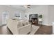 Bright living room with a ceiling fan and neutral-colored sectional sofa at 349 Lakota Loop, Longs, SC 29568