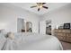 Neutral paint and a tray ceiling combine with the carpeted floors to create a cozy vibe in the main bedroom at 349 Lakota Loop, Longs, SC 29568