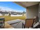 View of the covered patio featuring an outdoor rug, seating, and a grill overlooking a grassy lawn at 349 Lakota Loop, Longs, SC 29568