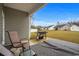 Back patio with outdoor grill, seating, a clear view of the backyard, and surrounding homes at 349 Lakota Loop, Longs, SC 29568