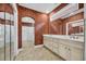 This bathroom features tile flooring, a double vanity, and a glass enclosed shower and tub at 3791 Cagney Ln., Myrtle Beach, SC 29577