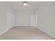 This bedroom features neutral walls and carpet flooring with a ceiling fan and closet at 3791 Cagney Ln., Myrtle Beach, SC 29577